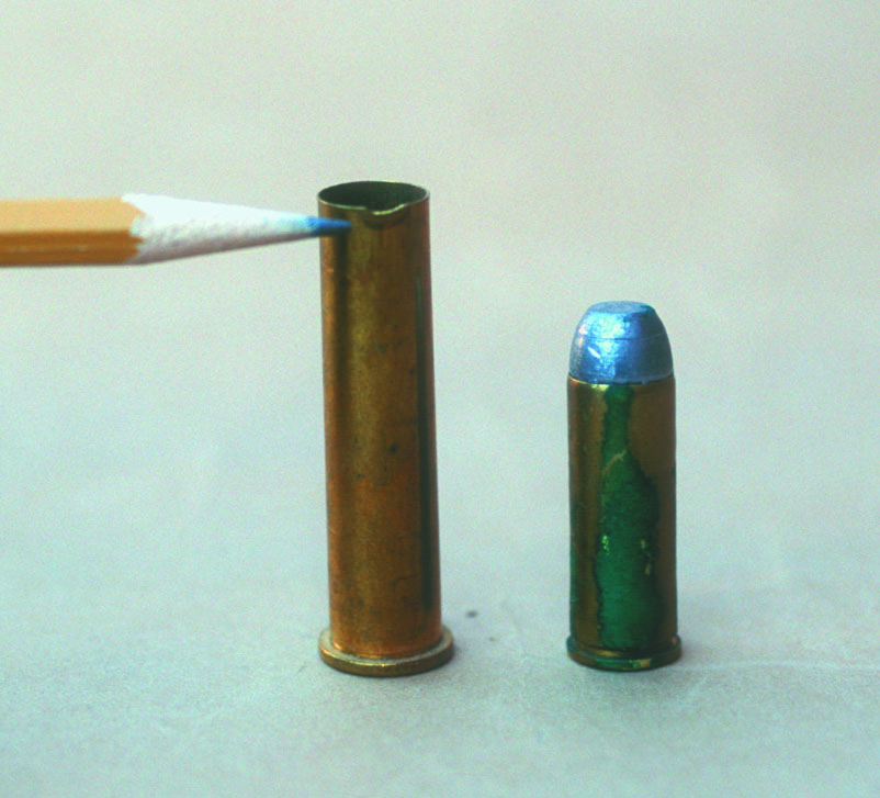 All cases should be carefully inspected for flaws or defects prior to handloading. The .45-70 case on the left is new but has a defect at the mouth, while the .45 Colt cartridge is flawed due to corrosion.